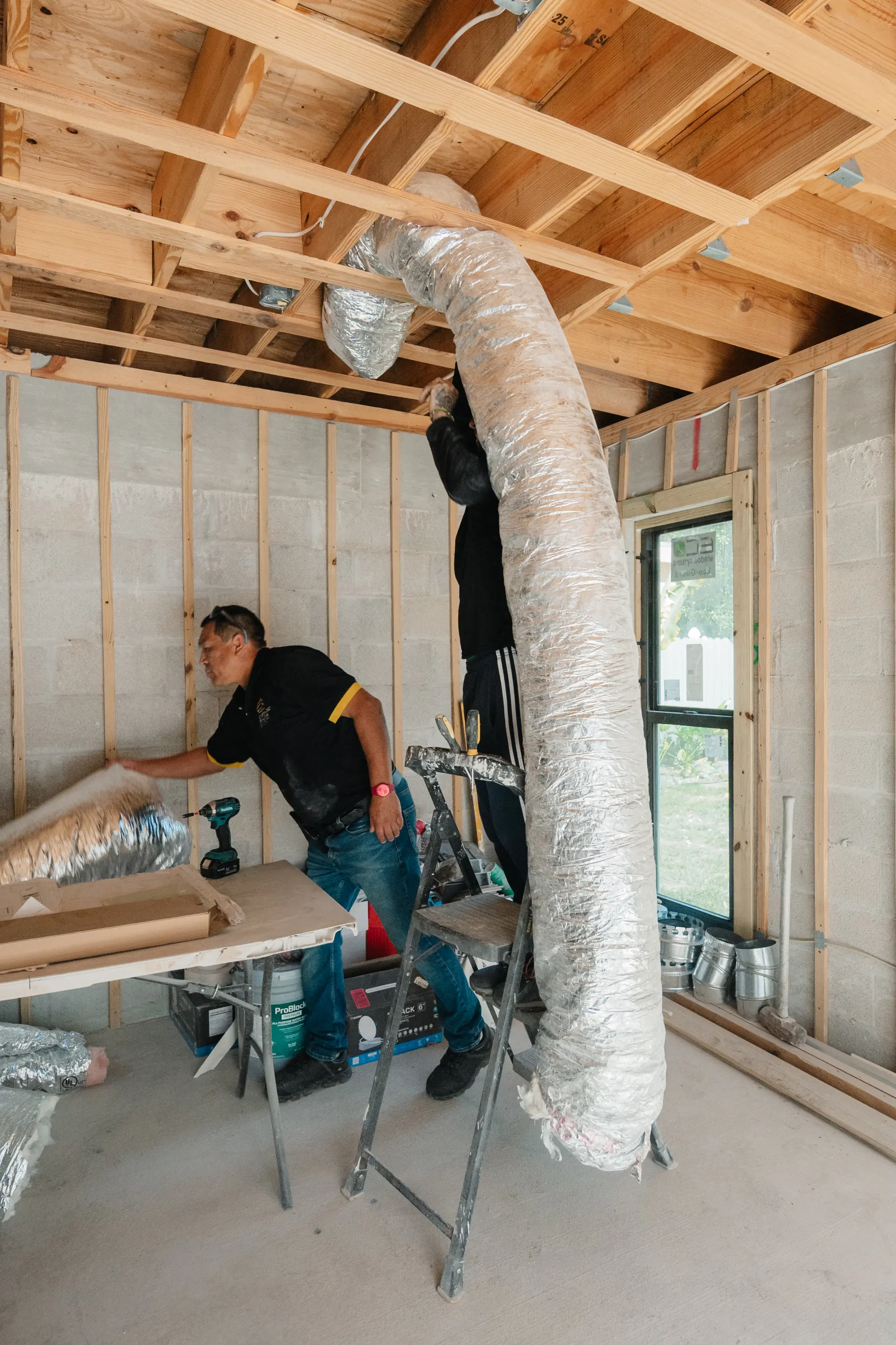 HVAC ductwork installation inside a home under construction